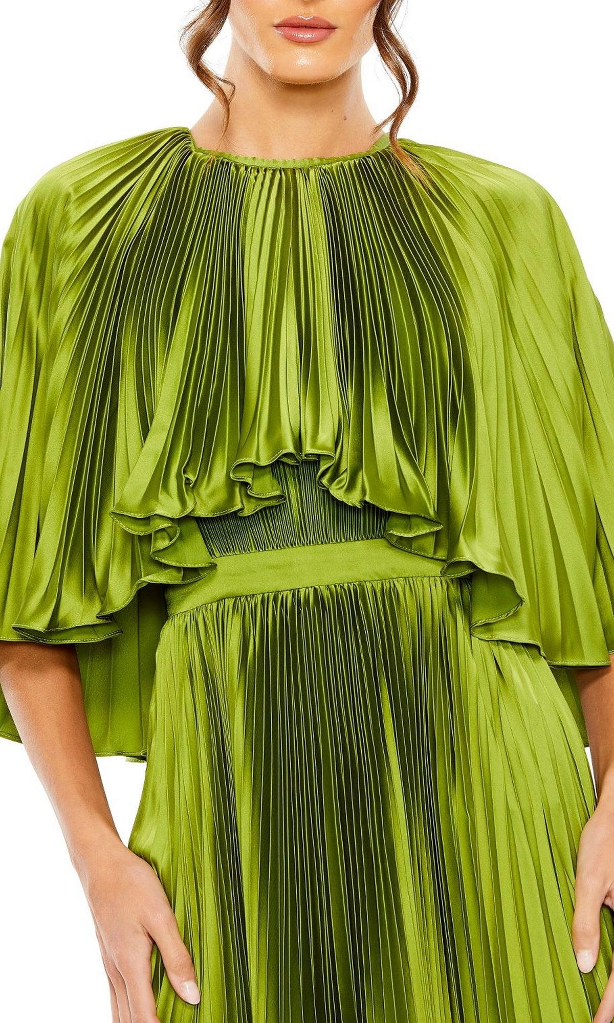 A woman wears the Caped Tea-Length Party Dress: Mac Duggal 49638 in shiny pleated green, featuring wide sleeves and a gathered waist, shown from mid-face to mid-thigh.